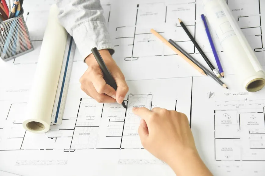 Creative Designers brainstorming with Interior, Architecture blueprint. Office supplies equipment